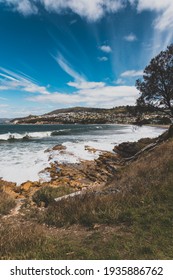 BLACKMANS BAY, TASMANIA - March 6th, 2020: view of the popular Blackmans Bay beach in southern Hobart on a very windy day with intense swell and waves 