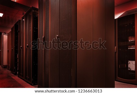 Blackout concept. Emergency failure red light in data center with servers. big data storage and cloud computing