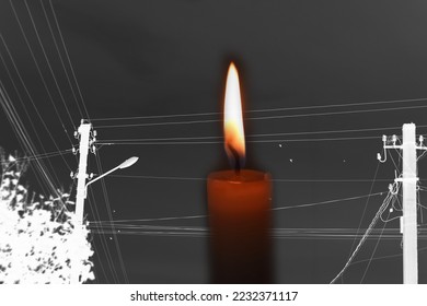 Blackout – power grid overloaded. Blackout concept. Earth hour. Burning flame candle and power lines on background. Energy crisis. Dark night. Candle flame. Voltage equipment. - Shutterstock ID 2232371117