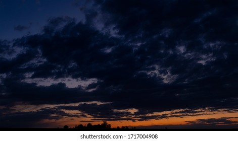 Blackout. Purple-magenta clouds. Tragic gloomy sky. Landscape with bloody sunset. Fantastic skies on the planet earth. Twilight, nightfall. - Shutterstock ID 1717004908
