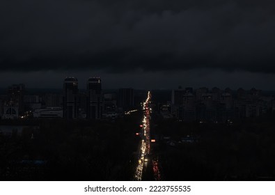 Blackout in the Ukrainian capital Kyiv. Capital streets without street lighting. Only the lights of passing cars are visible. - Shutterstock ID 2223755535