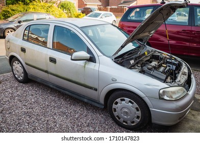 Blackpool, England, 19/04/20 Mouldy Rusted Vauxhall Astra Barn Find Old Car Covered In Moss And Algae As Well As Mould With The Bonnet Open Parked Up Left To Rot Away Unloved Vehicle To Be Restored 