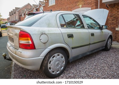 Blackpool, England, 19/04/20 Mouldy Rusted Vauxhall Astra Barn Find Old Car Covered In Moss And Algae As Well As Mould With The Bonnet Open Parked Up Left To Rot Away Unloved Vehicle To Be Restored 