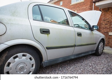 Blackpool, England, 19/04/20 Mouldy Rusted Vauxhall Astra Barn Find Old Car Covered In Moss And Algae As Well As Mould With The Bonnet Open Parked Up Left To Rot Away Unloved Vehicle To Be Restored 