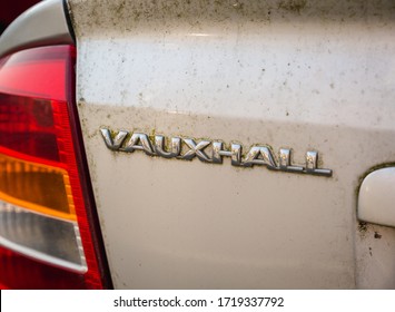 Blackpool, England, 19/04/20 Rear Vauxhall Logo On A Very Dirty Messy Car That Has Not Been Cleaned In Years On An Astra G Mk Mark 4 With Boot Opening Button Close Up On Logo 