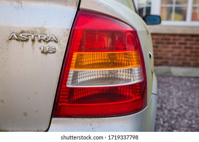 Blackpool, England, 19/04/20 Rear Vauxhall Logo On A Very Dirty Messy Car That Has Not Been Cleaned In Years On An Astra 1.6 G Mk Mark 4 With Boot Opening Button Close Up On Logo 