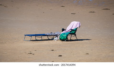 Blackpool, Lancashire  UK - July 18th 2021: Empty Sun Loungers And Towels On Beach