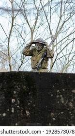 blackpool, uk, 05.02.2021 A gritty concrete world war two air raid soldier sculpture on top of a war bunker defence fortress in a dirty forgotten woodland in europe. wartime conflict relics.