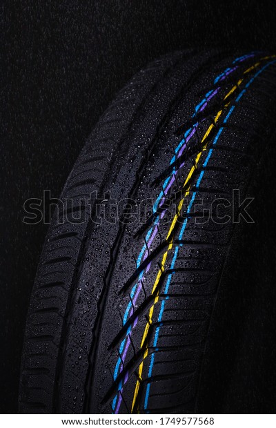 Black's tire tread detail in studio shoot made on
dark background tone.