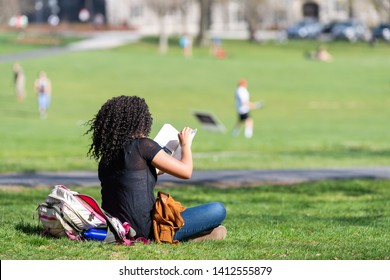 Blacksburg, USA - April 18, 2018: Historic Virginia Tech Polytechnic Institute And State University College Campus With Student Sitting Reading On Grass