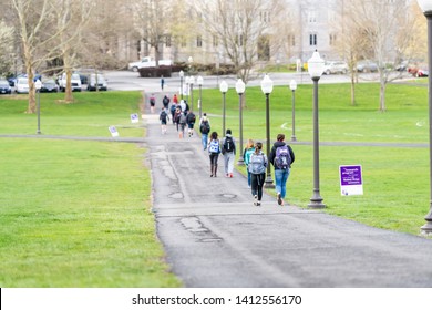 Blacksburg, USA - April 18, 2018: Virginia Tech Polytechnic Institute And State University College Campus With Many People Walking On Green Grass Drill Field