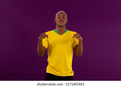 Black-skinned Brazilian Man With Brazilian Soccer Team Shirt In Studio Photo