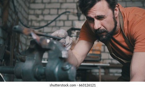 Blacksmith Checks The Symmetry Of The Knife Blanks