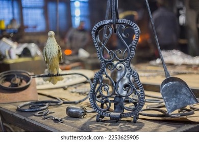 Blacksmith decorative elements at forge, workshop. Handmade, craftsmanship and blacksmithing concept
