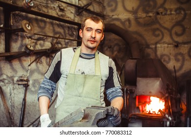 the blacksmith is at the forge