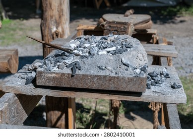 Blacksmith forge with coal and ash, ready for traditional metalworking and ancient craft production