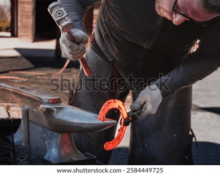 Similar – Image, Stock Photo Artisan blacksmith forging metal by fiery forge