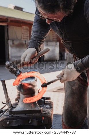 Similar – Image, Stock Photo Artisan blacksmith forging metal by fiery forge