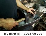 blacksmith working on the anvil
