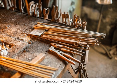 blacksmith workshop tools and metal ready for crafting - Powered by Shutterstock