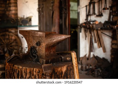 Blacksmiths tools, hammer and anvil in old Blacksmiths workshop, an ancient craft, old forge with burned oud furnace with lots blacksmith's equipment - Powered by Shutterstock