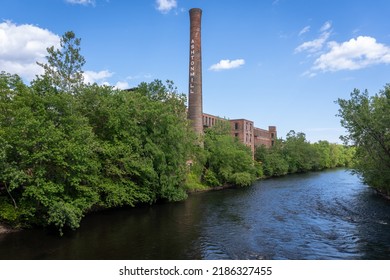 Blackstone River Valley National Historic Park. Ashton Mill brick smokestack. Former cotton mill now apartments for Providence area. Village remains example of a Rhode Island System mill village. - Shutterstock ID 2186327455