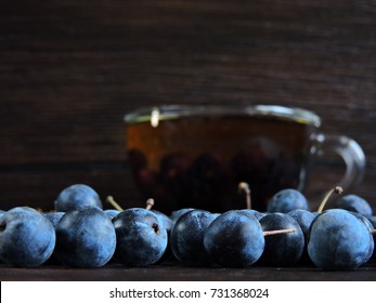 Blackthorn Berries And A Cup Of Tea. Macro. Copy Space.