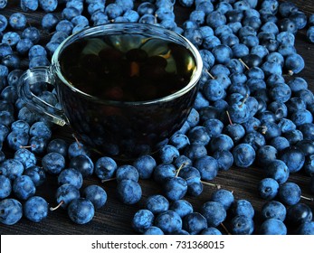 Blackthorn Berries And A Cup Of Tea. Top View.