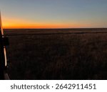 Blackwell , OK 
Something in the Orange Country dry wheat 
field 