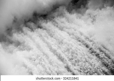 Black&white Close Up On Spillway On Hydroelectric Water Power Dam Background