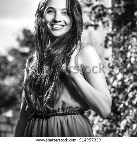 Similar – Image, Stock Photo Smiling girl with a hat pulling from her boyfriend hand in the street to take a walk.