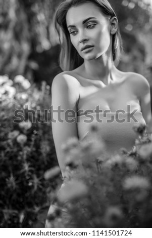 Similar – Portrait of woman in with red flower