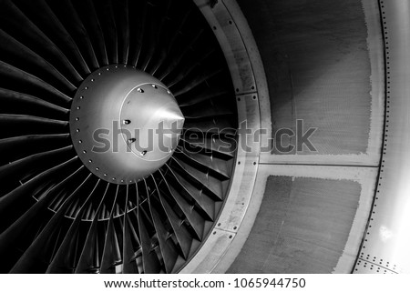 Blades of an aircraft engine close-up. Travel and aerospace concept. Black and white filter