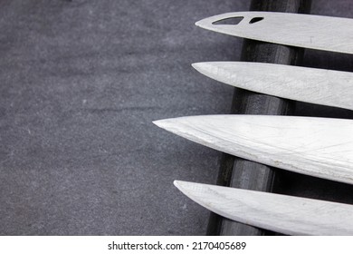 The Blades of knives concept. Sharp steel blades of knives on a dark background. Sharp knives collection. - Shutterstock ID 2170405689