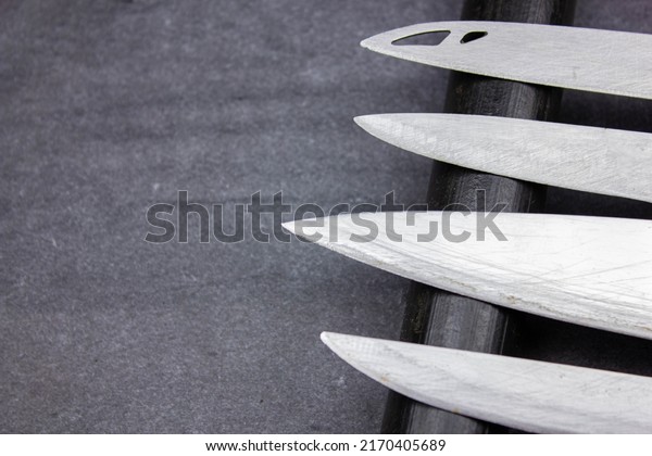 The Blades of knives
concept. Sharp steel blades of knives on a dark background. Sharp
knives collection.