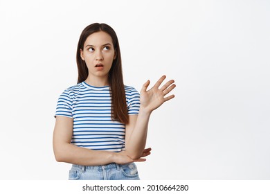 Blah Blah Enough So Annoying. Irritated Young Woman Roll Eyes And Wave Hand In Rejection, Refuse Smth Bothering, Tired Of Listening, Stop Talking Gesture, Standing Against White Background