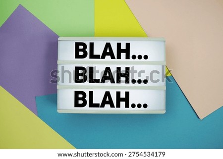 Blah Blah Blah text in lightbox flat lay on colorful pastel background