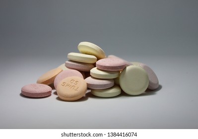 Blaine, WA / USA - April 25, 2019: A Handfull Of Colorful, Fruit Tums Antacid Tablets Lie Stacked On A White/gray Background. Illustrative Editorial