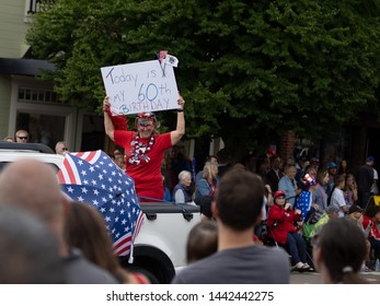 Blaine, WA / USA – July 4, 2019: Old Fashioned Fourth Of July Parade And Celebration. A Lady In A Car Holding A Sign Saying Its Here 60th Birthday