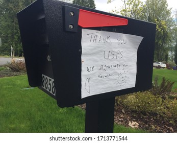 Blaine, WA /USA-April 22, 2020: Homeowner Expresses Gratitude To Their Postal Worker While President Trump Expresses Continued Calls For Elimination Of The US Postal Service. Illustrative Editorial.