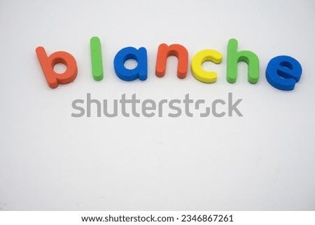 Blanche in lowercase magnetic alphabet characters