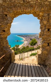 Blanes Beach Through A Stone Door Of St. John Castle. Aerial Panoramic View In Costa Brava In A Beautiful Summer Day, Spain