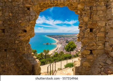 Blanes Beach Through A Stone Door Of St. John Castle. Aerial Panoramic View In Costa Brava In A Beautiful Summer Day, Spain