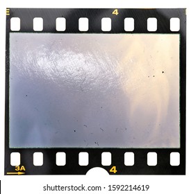 blank 35mm film frame or strip on white background with empty frame or window and light reflection