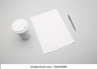 Blank A4 Paper With Coffee On Gray Background