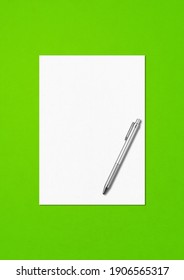 Blank A4 Paper Sheet And Pen Mockup Template Isolated On Green Background