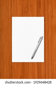 Blank A4 Paper Sheet And Pen Mockup Template Isolated On Dark Wooden Background