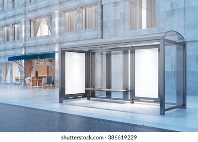 Blank Ad Banners At A Bus Stop At Night With Concrete Building And Cafe In The Background. Mock Up, 3D Render