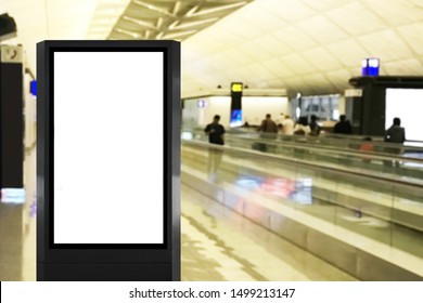 Blank advertisement billboard poster mock up at airport with long walkalator and blurred people as background