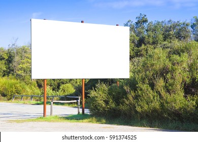 Blank Advertising Billboard Immersed In A Rural Scene